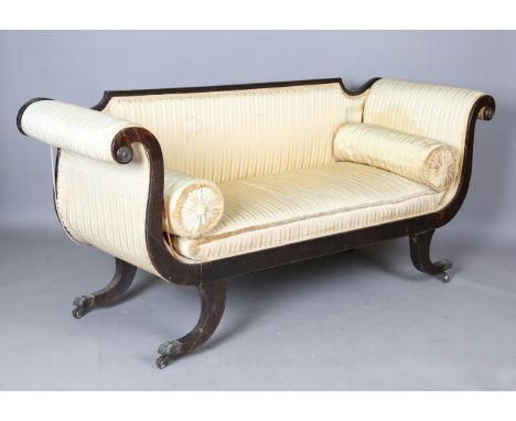 A Regency simulated rosewood scroll end showframe settee, on sabre legs with brass paw caps and castors, height 85cm, width 1