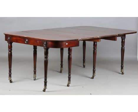 A 19th century mahogany fold-over concertina-action dining table, in the manner of Wilkinson of Moorfields, London, the top w