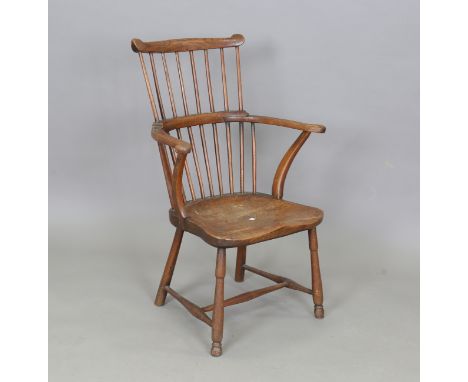 A 19th century primitive beech and elm stick back Windsor armchair, height 86cm, width 60cm, depth 54cm.Buyer’s Premium 29.4%