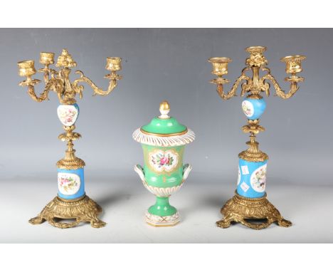 A pair of late 19th century gilt metal and porcelain mounted three-light candelabra, height 36.5cm, together with a Dresden p