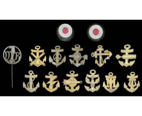 German Second War Kriegsmarine Shoulder Board Motifs. 11 Kriegsmarine shoulder board motifs; together with 2 cap cockades and