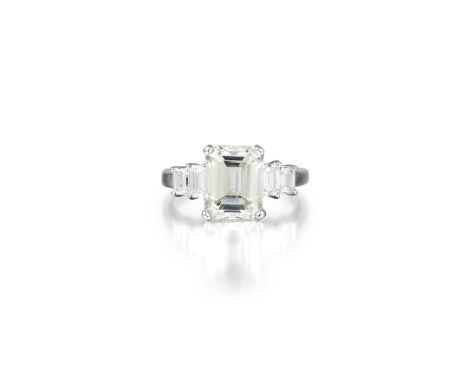 Featuring a centered emerald-cut diamond, weighing 3.44 carats, with M color and VS1 clarity, flanked by four emerald-cut dia