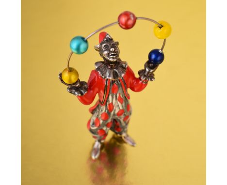 Depicting a juggling clown, crafted out of sterling silver, enhanced with colorful enamel; measures 10.5 x 5.5 cm; weight 153