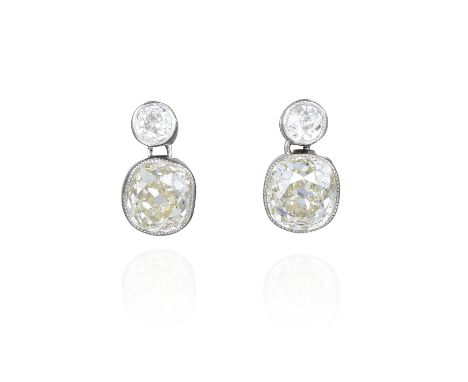 Each earring features one antique cushion-cut diamond top, weighing approximately 0.10 carats, with J-K color and I clarity, 