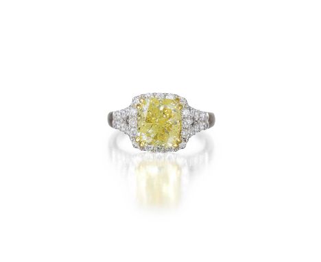 Featuring a Fancy Light Yellow diamond, weighing approximately 3.80 carats, with I1 clarity, surrounded by small brilliant cu