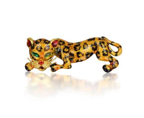 Depicting a leopard, made of 18K yellow gold, enhanced with colored enamel; dimensions 5.3 x 2.0 cm; weight 19.5g.  Stamped 7