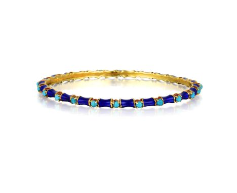 Featuring turquoise cabochons mounted in 18K yellow gold, enhanced with deep blue enamel; inner circumference measuring 7-1/4
