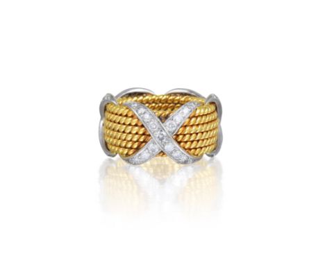 Featuring small brilliant-cut diamonds, weighing approximately 0.77 carats, mounted in 18K yellow gold and platinum; ring siz