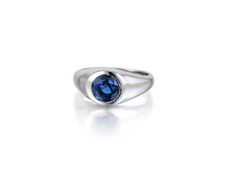 Featuring one round-cut sapphire, weighing approximately 1.55 carats, mounted in platinum; ring size 7; weight 11.4g. Signed 