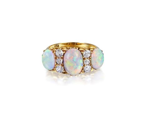 Featuring three oval-shaped opal cabochons, enhanced with six old European-cut diamonds, weighing approximately 0.55 carats, 