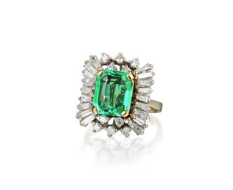 Featuring a centered emerald-cut emerald, weighing approximately 2.20 carats, surrounded by baguette and brilliant-cut diamon