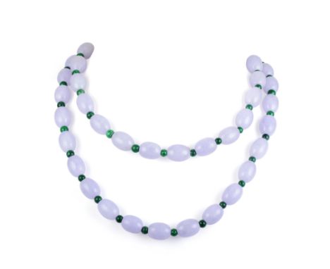 Featuring oval lavender jade beads, separated by small jade beads, with an 18K white gold clasp; length 33 inches; weight 144
