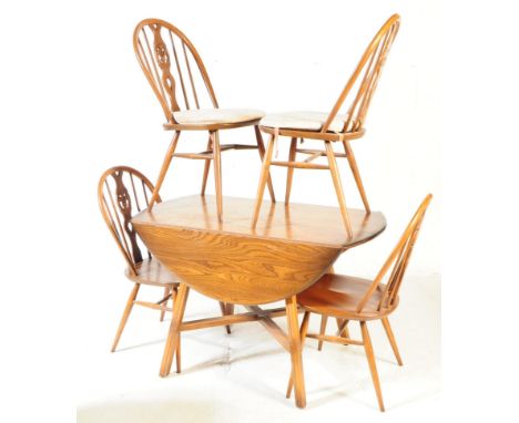Ercol #377 old colonial drop leaf extending dining table and 4 chairs. The table of a beech wood construction is supported vi