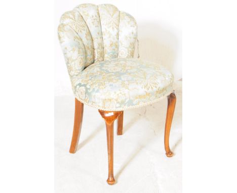 A 1930s Art Deco era fan back boudoir / dressing table chair. The chair having scalloped cushioned back over padded seat rais