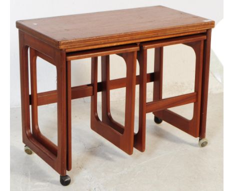 McIntosh Furniture - A vintage 20th century teak nest of tables. Rectangular form with quadrille style legs, smaller side tab