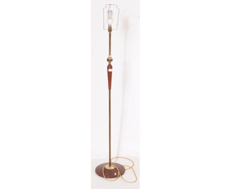 A mid Century retro Danish inspired teak floor standing standard lamp having abstracted tapering details to shaft and raised 
