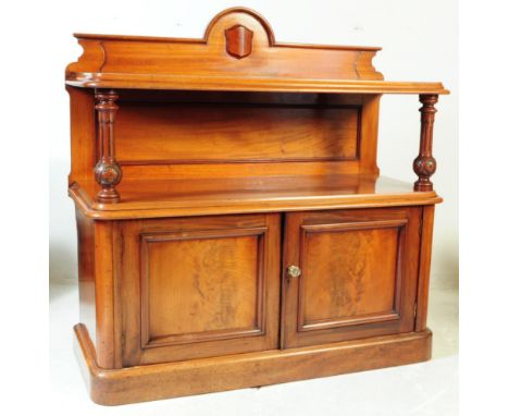 A 19th century Victorian mahogany galleried buffet sideboard. The buffet having a twin door cupboard to lower, with carved su