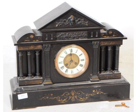 A large 19th Century Victorian slate eight day movement mantel clock. Having white enamel and gilt face with Roman Numeral ch