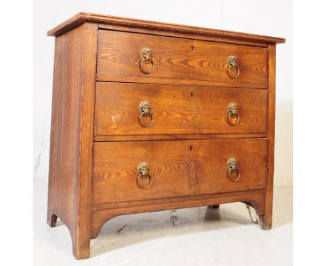 An early 20th century Arts &amp; Crafts oak chest of drawers. Rectangular flared top with a bank of three drawers. Raised on 