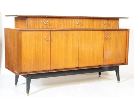 E Gomme for G Plan Librenza tola sideboard credenza. Mid century circa 1960s having a floating shelf over a run of three draw