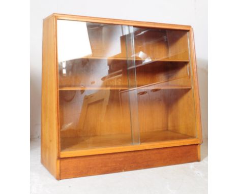 G-Plan - Brandon Range - A retro mid 20th century circa 1960s light oak glazed front bookcase cabinet. The bookcase having tw