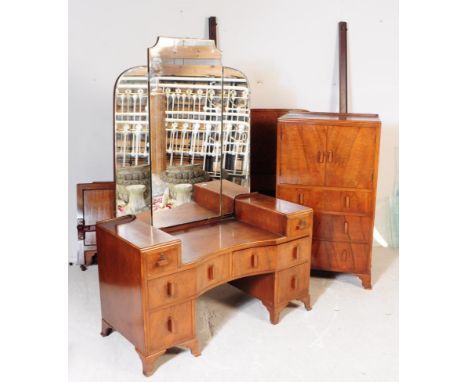 A 1930s Art Deco walnut bedroom suite comprising of a drop centre dressing table, having pedestals of drawers with deco pull 