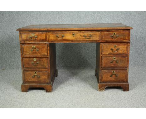 A 19th century burr walnut pedestal desk of compact size in the Georgian style. (Comes in three parts). H.70 W.117 D.60cm. 
