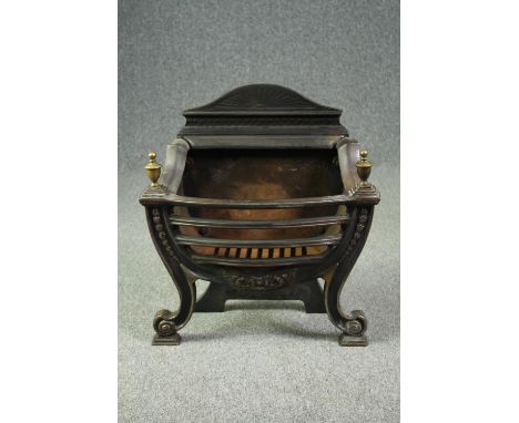 A vintage steel and cast iron fire grate in the Regency style. H.63 W.58 D.29cm. 