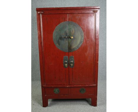 Hall cupboard, Chinese lacquered with incised bronze locking plate and fitted with base drawers. H.180 W.102 D.58cm. 