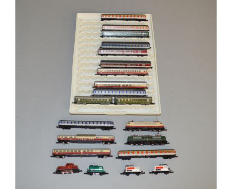 Z Gauge. 18 unboxed Marklin Mini-Club Coaches and Wagons in various different liveries together with 3  unboxed Locomotives. 