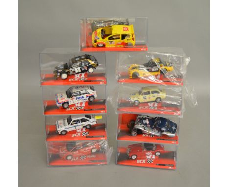 9 boxed SCX slot cars, which includes; #64320 Ford Escort MKII, #64000 Morgan Aero 8 etc (9)