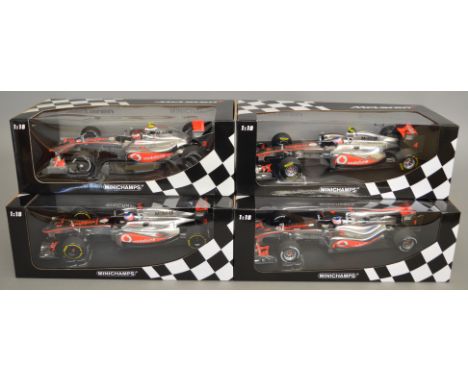 4 boxed Minichamps Vodafone McLaren Mercedes F1 car models in 1:18 scale including MP4-24 Kovalainen 2009, MP4-25 J. Button 2