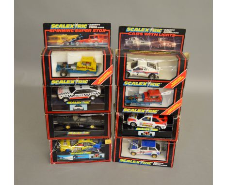 8 boxed Scalextric slot cars, which includes; #C.331 Melitta Metro, C.362 Police Car with roof light etc (8)