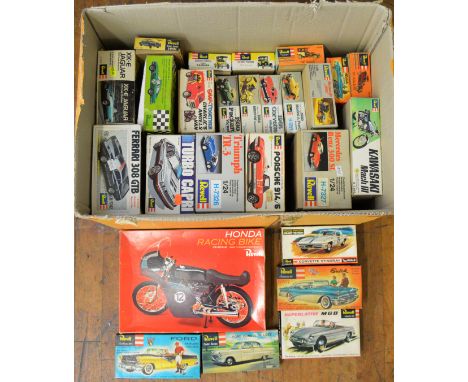 26 Car and Motorcycle related Model Kits by Revell in a variety of different scales including vintage examples. All opened pa