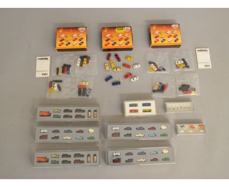 Z Gauge. 9 boxed Marklin Mini-Club miniature vehicle sets including cars, vans, small trucks etc. a boxed set of figures and 