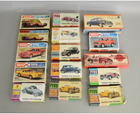 14 boxed vintage plastic model car kits by Pyro, Monogram and others including Road and Race cars, together with a vintage AC