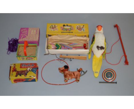 A varied selection of unboxed dolls, bears and other soft toys including a vintage straw filled bear with hump back, two plas