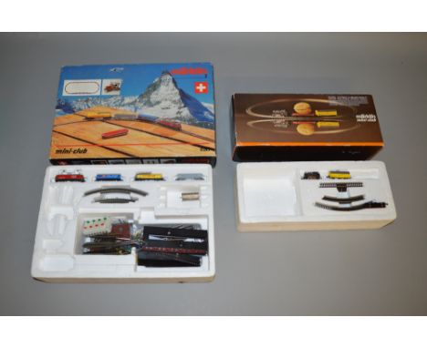 Z Gauge. 2 boxed but incomplete Marklin Mini-Club Train sets, 8185 BR re 4/4 SBB with three Wagons and some other contents an