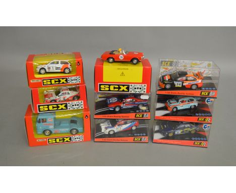 9 boxed slot car models by SCX, which includes; Mercedes Truck ESSO #83840.20, Seat Ibiza Coupe #83900.20 etc(9).&nbsp;