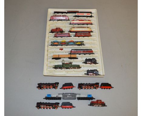 Z Gauge. 13 unboxed Marklin Mini-Club Locomotives together with 7 Wagons of various different types.. Conditions vary. (20)