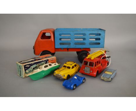 A mixed group of unboxed Tri-ang Toys including a #6059 Pressed Steel Diesel Farm Truck, a Spot-On Vauxhall Cresta and three 