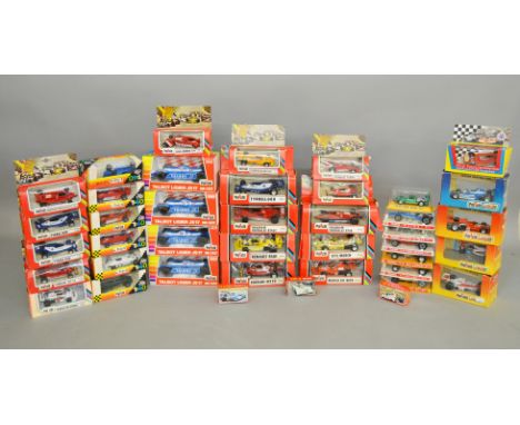 A good quantity of boxed diecast Racing Car models, mainly by Polistil, in a variety of different scales together with six by