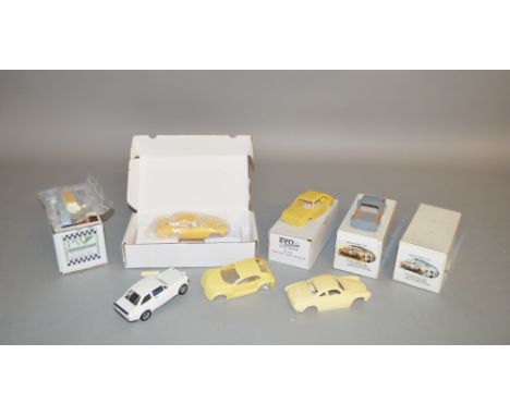 4 boxed resin slot car kits by Arrow, PW etc, two of which have been started, together with 3 car bodies. All unchecked for c