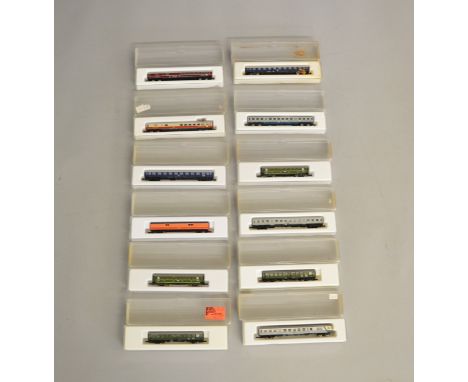 Z Gauge. 12 boxed Marklin Mini-Club Coaches of various different types including DB and Southern Pacific liveries, all appear