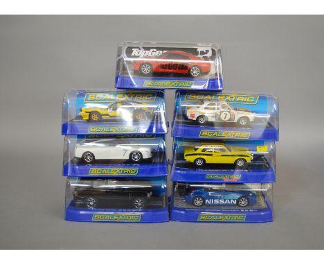 7 boxed slot cars by Scalextric, which includes; #C3070 Nissan GT-R, #C2974 Ferrari 308 GTB etc (7)