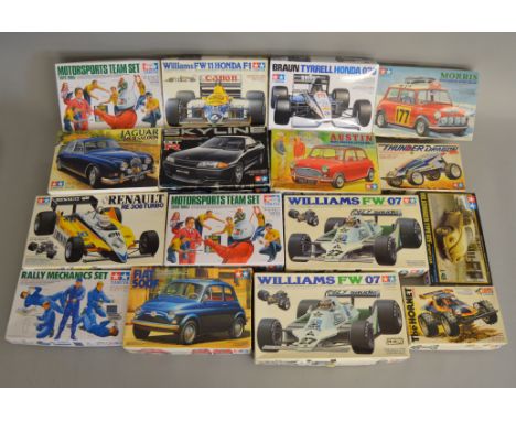 16 Car related Model Kits by Tamiya in various different scales including both Road and Race cars. All opened packaging is un