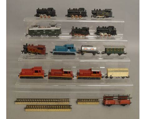 HO/OO Gauge. 11 unboxed Locomotives by Lima, Marklin and others together with four unboxed pieces of Rolling Stock. Condition