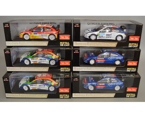 6 boxed 1:18 scale rally related diecast models by Sun Star (6)