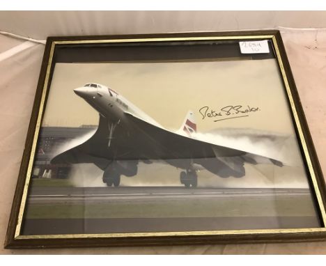 A framed photograph of Concord taking off, signed by Assistant Chief Test Pilot Peter Baker who flew on the first and last fl