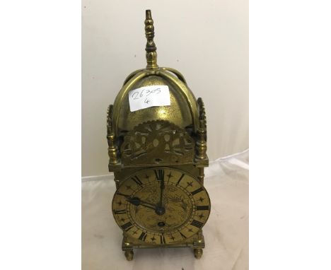 A brass lantern clock, chapter ring marked Laing, Glasgow with Buren movement